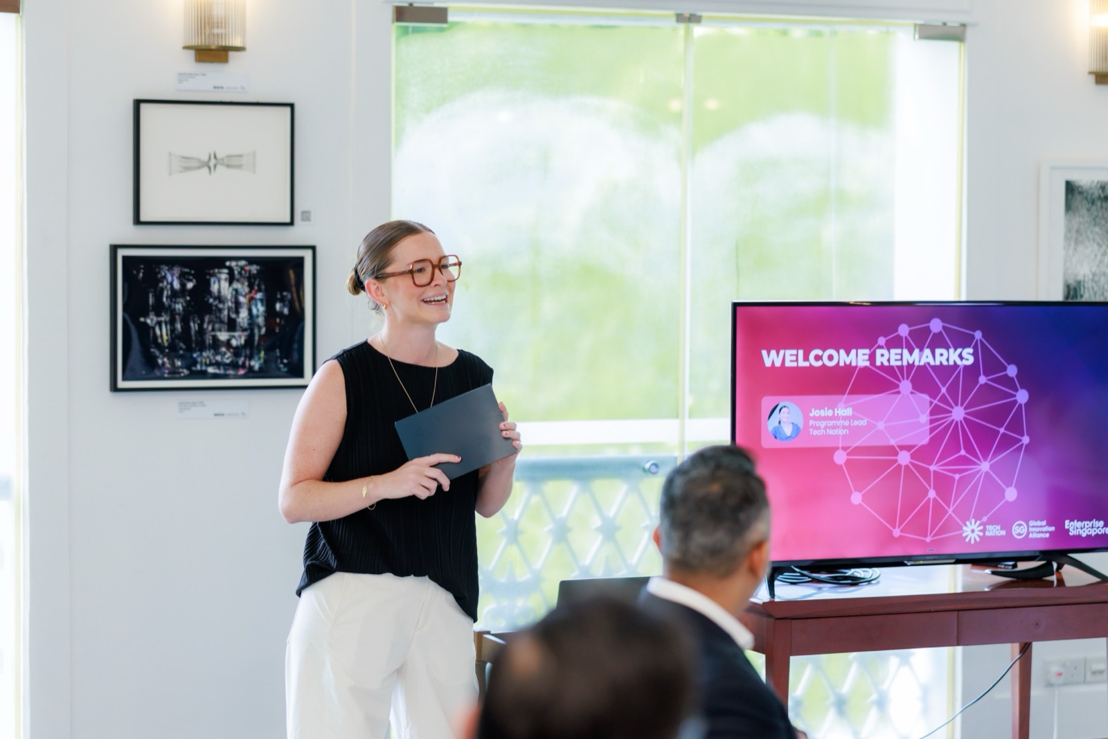 Josie Hall giving welcome remarks to a room of founders